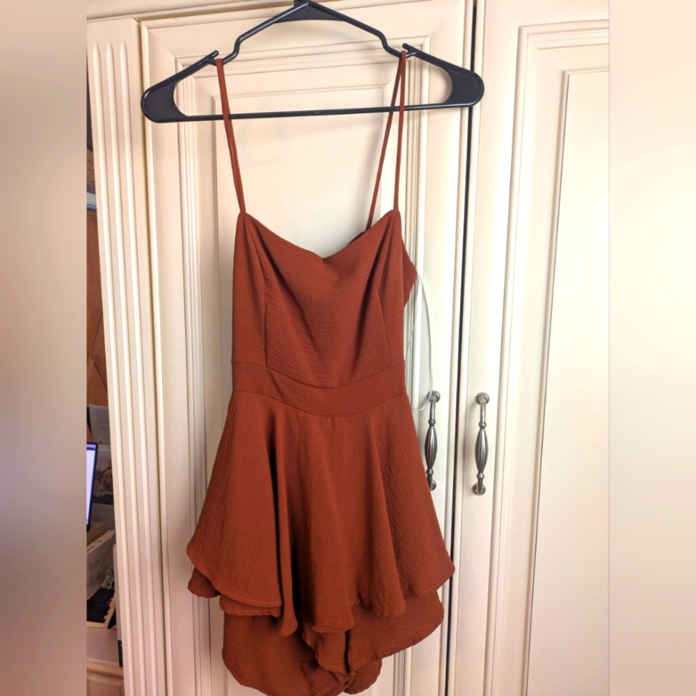New spaghetti strap romper from Windsor. Color is burnt orange/brown. Size Small